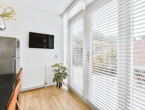 Narrow small room with large sliding windows to the floor